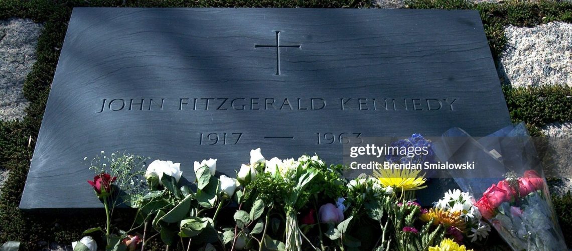 WASHINGTON, DC - NOVEMBER 14:  Visitors pay their respects by leaving flowers at the grave of assassinated U.S. President John F. Kennedy in Arlington National Cemetery November 22, 2003 in Arlington, Virginia.  Saturday marked the 40th anniversary of JFK's assassination in 1963.  (Photo by Brendan Smialowski/Getty Images)